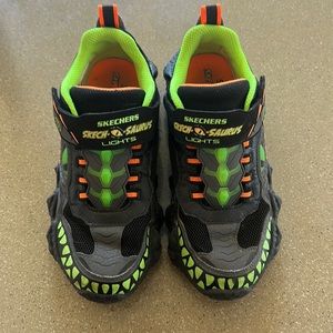 Sketchers “skech-o-saurus” shoes.